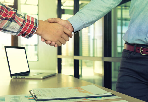 Businessman hand together Handshake for business project teamwork